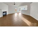 Bright living room with tile flooring, fireplace, and access to backyard at 811 Reigate Rd, Charlotte, NC 28262