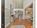 Bright and spacious two-story entryway with hardwood floors at 10718 Lederer Ave, Charlotte, NC 28277