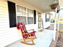 Inviting front porch with rocking chair, perfect for relaxing at 1105 Mount Olivet Rd, Kannapolis, NC 28083