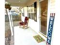 Welcoming front porch featuring a rocking chair and welcome mat at 1105 Mount Olivet Rd, Kannapolis, NC 28083