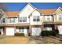 Two-story townhome with brick facade and attached garage at 11646 Rabbit Ridge Rd, Charlotte, NC 28270