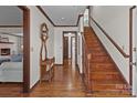 Hardwood floors and wooden staircase in the entryway at 1212 Ridge St, Albemarle, NC 28001