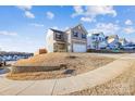 Two-story house on a sloped lot with a curved sidewalk at 128 Mooring Dr, Statesville, NC 28677