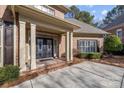 Elegant entryway with double doors and columns at 15409 Brem Ln, Charlotte, NC 28277