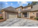 Two-car garage with light beige doors at 15409 Brem Ln, Charlotte, NC 28277