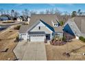 Stunning aerial view of a charming house and neighborhood at 16303 Cozy Cove Rd, Charlotte, NC 28278