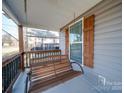 Relaxing front porch swing adds to the home's charm at 17 Walnut St, China Grove, NC 28023