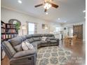 Spacious living room with sectional sofa and hardwood floors at 17 Walnut St, China Grove, NC 28023