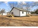 White house with gray roof, wooden deck and steps in the backyard at 19601 S Ferry St, Cornelius, NC 28031