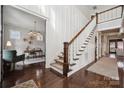 Grand entryway with hardwood floors, staircase, and home office at 2043 Shenandoah Ave, Charlotte, NC 28205