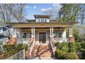 Two-story craftsman home with brick stairs and a covered porch at 2043 Shenandoah Ave, Charlotte, NC 28205