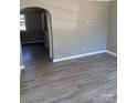 Living room with gray walls and wood-look flooring at 2505 Druid Hills Way, Charlotte, NC 28206