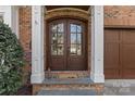 Elegant double front doors with sidelights and a welcoming entryway at 303 Hillside Ave, Charlotte, NC 28209