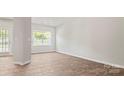 Spacious dining area with wood-look floors and large window at 3148 Ora Smith Rd, Lincolnton, NC 28092