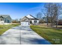 House exterior with a driveway and landscaping at 335 Pinewood Ln, Rock Hill, SC 29730