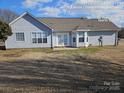 Gray sided home with a back patio at 4630 Sw Falcon Chase Sw Dr, Concord, NC 28027