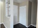 Bright entryway with built-in shelving and closet at 4902 Spring Lake Dr # E, Charlotte, NC 28212