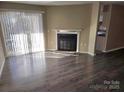 Living room with fireplace and hardwood floors at 4902 Spring Lake Dr # E, Charlotte, NC 28212