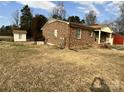 A view of the backyard of this single-story home with a shed at 740 Jackson Rd, Salisbury, NC 28146