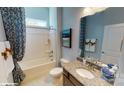 Modern bathroom with a tub, granite vanity, and updated fixtures at 8012 Plymouth Dr, Sherrills Ford, NC 28673