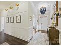 Bright and spacious entryway with wainscoting and hardwood floors at 8130 Clems Branch Rd, Fort Mill, SC 29707