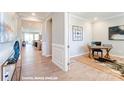 Bright entryway with view into home office and living area at 9842 Quercus Ln, Huntersville, NC 28078