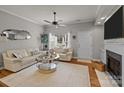 Light and airy living room with a fireplace and neutral decor at 12250 Savannah Garden Dr, Charlotte, NC 28273