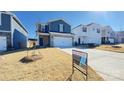 Two-story house with gray siding, brick accents, and a two-car garage at 1260 31St Ne St, Hickory, NC 28613