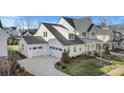 Aerial view of house and neighborhood, showcasing landscaping and community at 13308 Oak Farm Ln, Huntersville, NC 28078