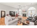 Spacious living room with hardwood floors and fireplace at 15214 Mccomb Manor Ct, Charlotte, NC 28277