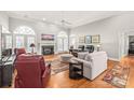 Living room features hardwood floors, fireplace, and ample seating at 15214 Mccomb Manor Ct, Charlotte, NC 28277