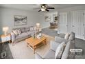 Virtually staged living room with light gray couch and coffee table at 165 Bowman Rd, Statesville, NC 28625