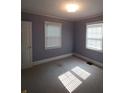 Spacious bedroom with neutral walls and carpeted floors at 1814 Logie Ave, Charlotte, NC 28205