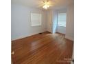 Bright bedroom with hardwood floors and window blinds at 1814 Logie Ave, Charlotte, NC 28205