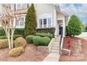 Townhome entrance with landscaping and stone accents at 201 Waterlynn Ridge Rd # E, Mooresville, NC 28117