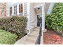 Townhome's front door with wreath and black railing at 201 Waterlynn Ridge Rd # E, Mooresville, NC 28117