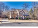 Two-story brick home with a large front yard and driveway at 209 Squirrel Ln, Lake Wylie, SC 29710