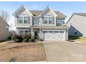 Two-story house with gray siding, white trim, and a two-car garage at 2262 Galloway Sw Ln, Concord, NC 28025