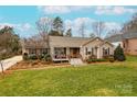 Charming ranch home with front porch and manicured lawn at 260 Wood Duck Loop, Mooresville, NC 28117