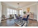 Spacious dining room featuring a large table, chandelier, and hardwood floors at 324 Mill Ridge Rd, Rock Hill, SC 29730