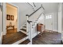 Bright entryway with hardwood floors and elegant staircase at 324 Mill Ridge Rd, Rock Hill, SC 29730