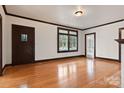 Spacious living room featuring hardwood floors, a fireplace, and large windows at 357 7Th Nw St, Hickory, NC 28601