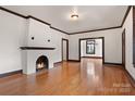 Bright living room with hardwood floors, fireplace, and high ceilings at 357 7Th Nw St, Hickory, NC 28601