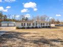 Ranch home with a two-car garage and expansive yard at 3717 Elliott Cemetary Rd, Shelby, NC 28150