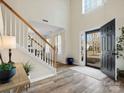 Bright foyer with hardwood floors, staircase, and natural light streaming through the front door at 3865 Parkers Ferry Rd, Fort Mill, SC 29715