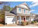 Two-story house with stone accents and a covered porch at 4152 Broadstairs Sw Dr, Concord, NC 28025