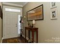 Bright and spacious entryway with hardwood floors and decorative wall art at 417 Spring Arbor Ave, Salisbury, NC 28146