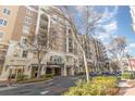 Modern condo building with gated parking and shops nearby at 4620 Piedmont Row Dr # 318D, Charlotte, NC 28210