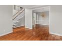 Hardwood floor dining room with chandelier at 5972 Rathlin Nw Ct, Concord, NC 28027