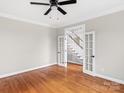 Sitting room with hardwood floors and French doors at 5972 Rathlin Nw Ct, Concord, NC 28027